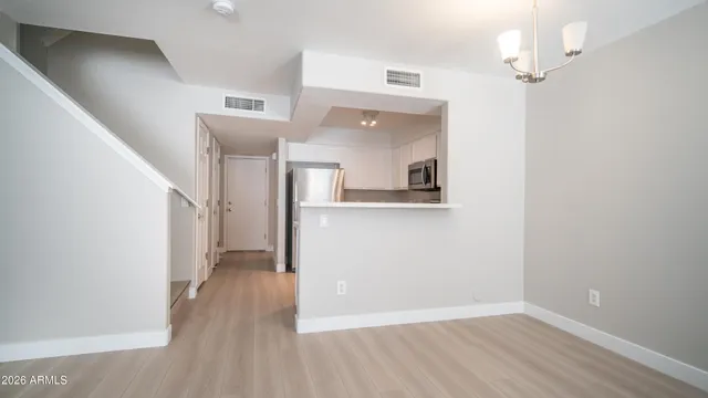 a view of a kitchen cabinets and wooden floor
