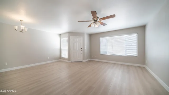 a view of room with hardwood floor and window