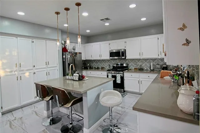 a view of green field with trees in the background