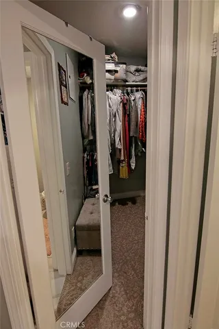 a bedroom with furniture and flat screen tv