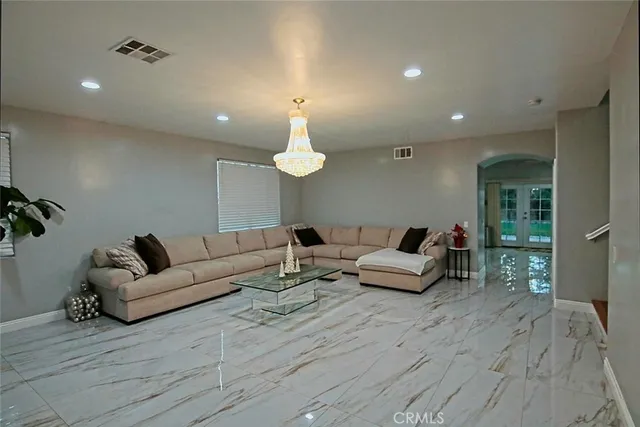 a kitchen with stainless steel appliances kitchen island granite countertop a sink and cabinets
