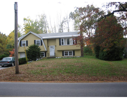 60 Lancaster Road Clinton, MA 01510 - Photo 2 of 3 a view of a house with a yard and large tree