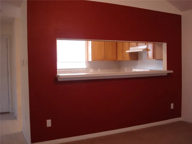 a kitchen with a refrigerator and a sink