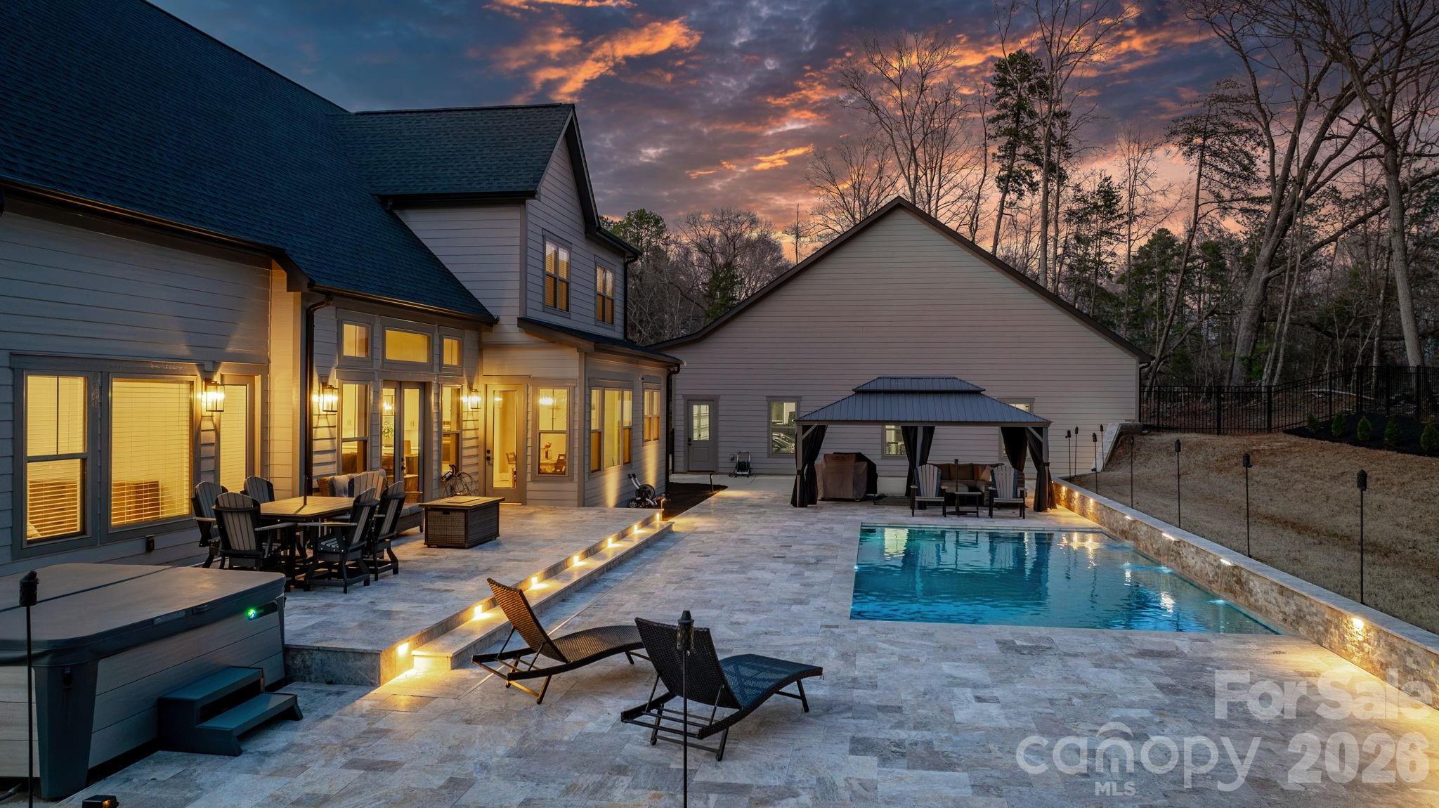7269 Savannah Denver, NC 28037 - Photo 2 of 48 a view of a patio with table and chairs with a barbeque grill and couches