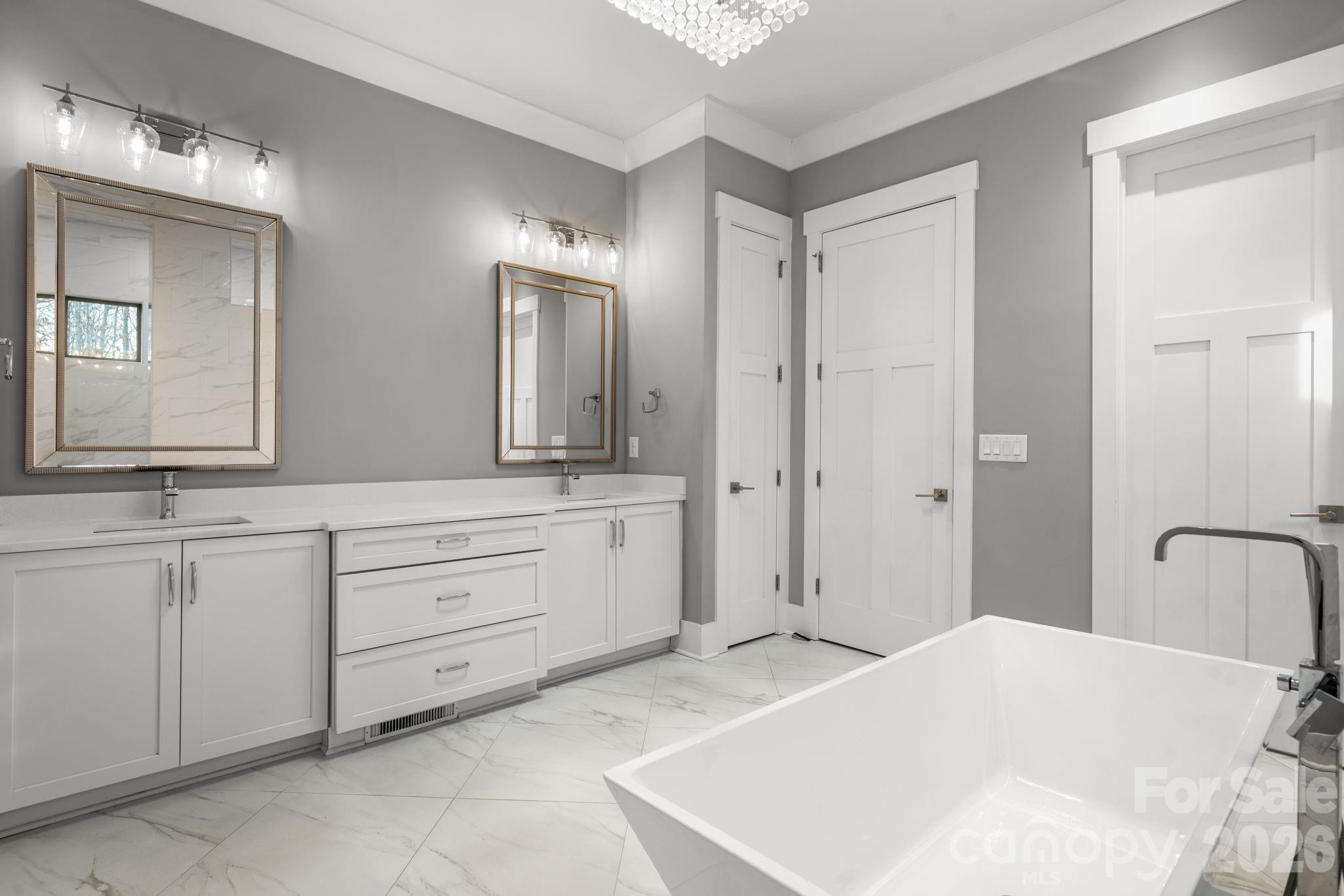 7269 Savannah Denver, NC 28037 - Photo 21 of 48 a bathroom with a sink and a mirror