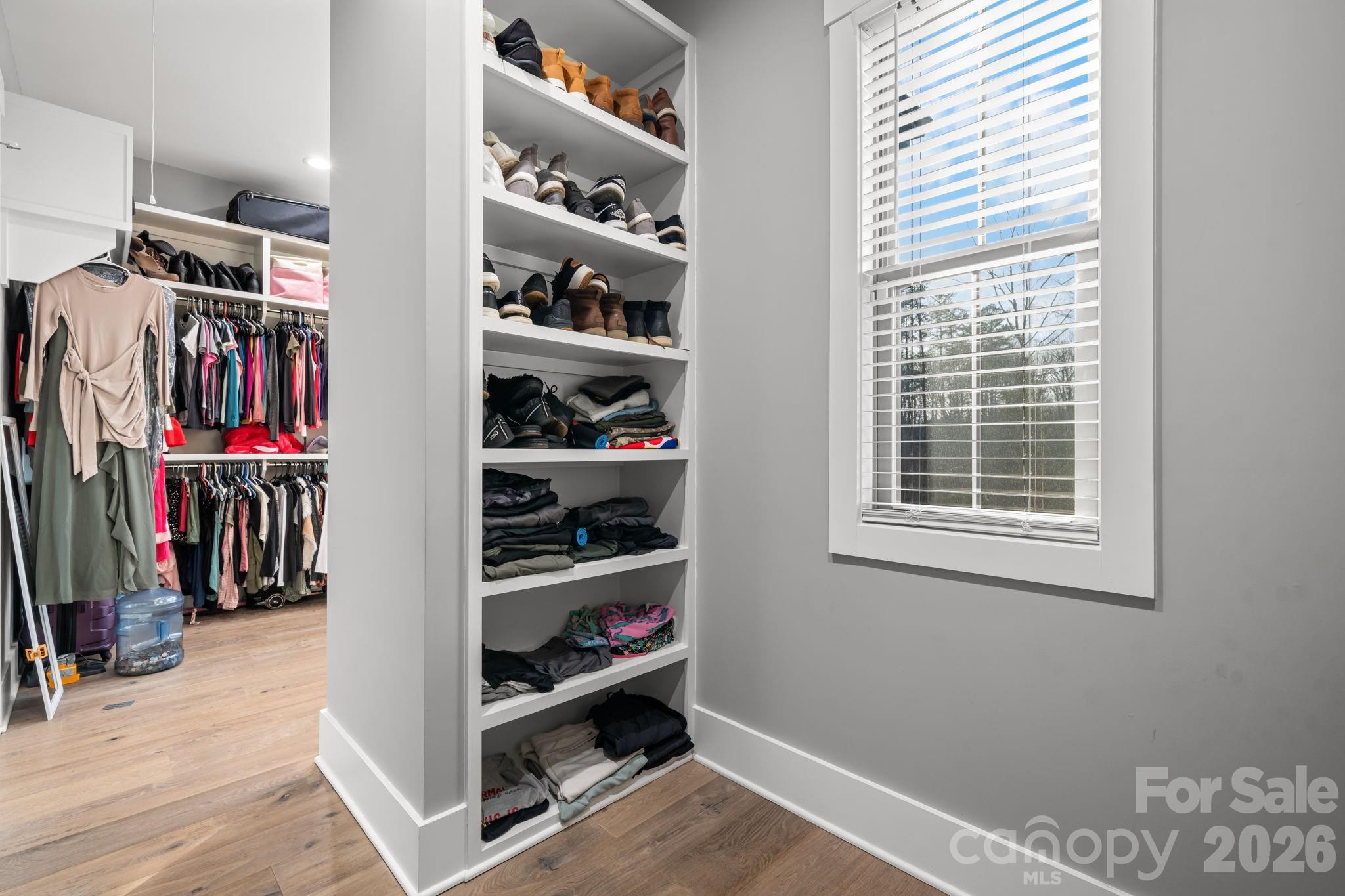 7269 Savannah Denver, NC 28037 - Photo 22 of 48 a view of walk in closet with clothes and shoes