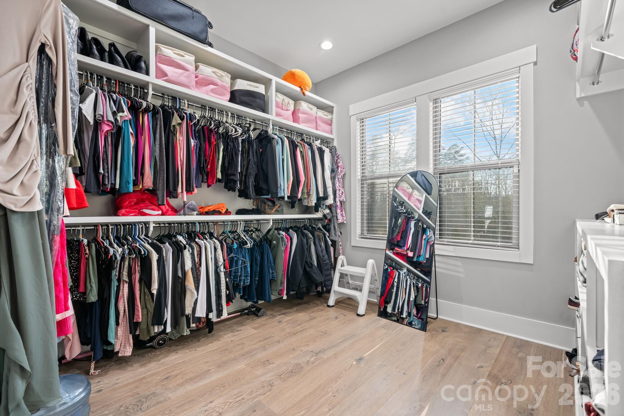 7269 Savannah Denver, NC 28037 - Photo 23 of 48 a view of walk in closet with clothes