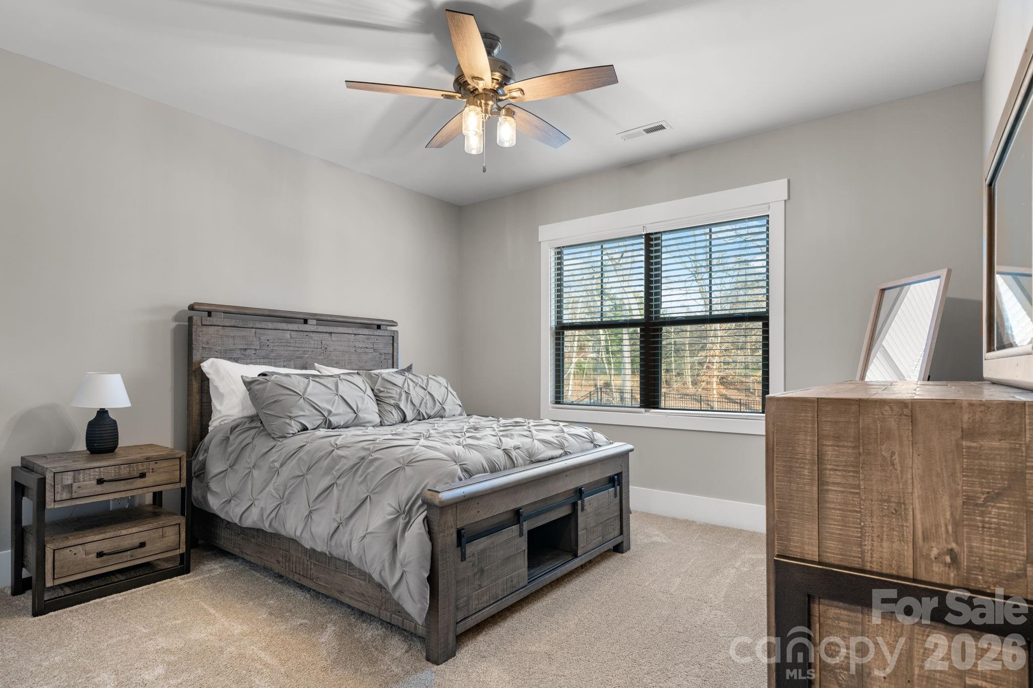 7269 Savannah Denver, NC 28037 - Photo 30 of 48 a bedroom with a bed and a window