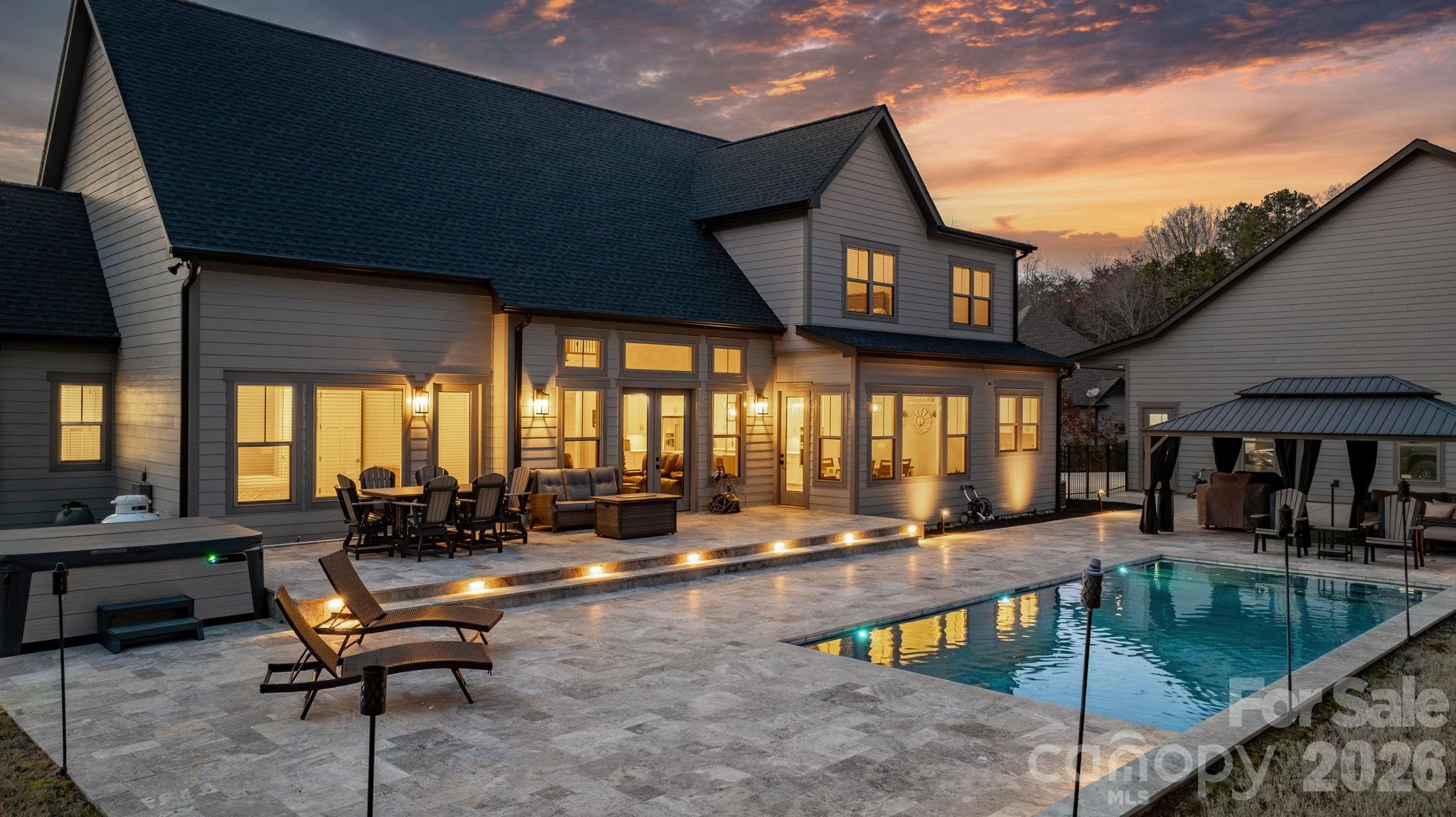 7269 Savannah Denver, NC 28037 - Photo 3 of 48 a living room with furniture a large window and kitchen view