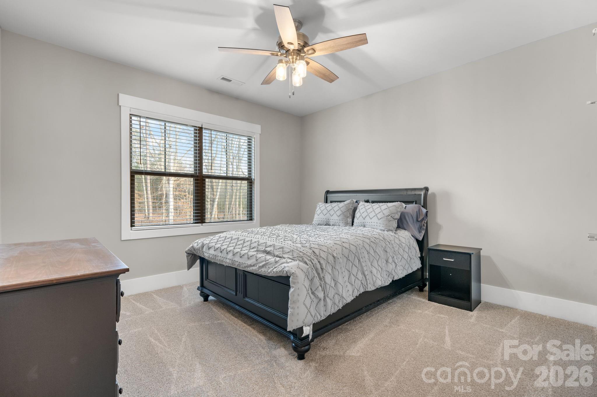 7269 Savannah Denver, NC 28037 - Photo 32 of 48 a bedroom with a bed and a window