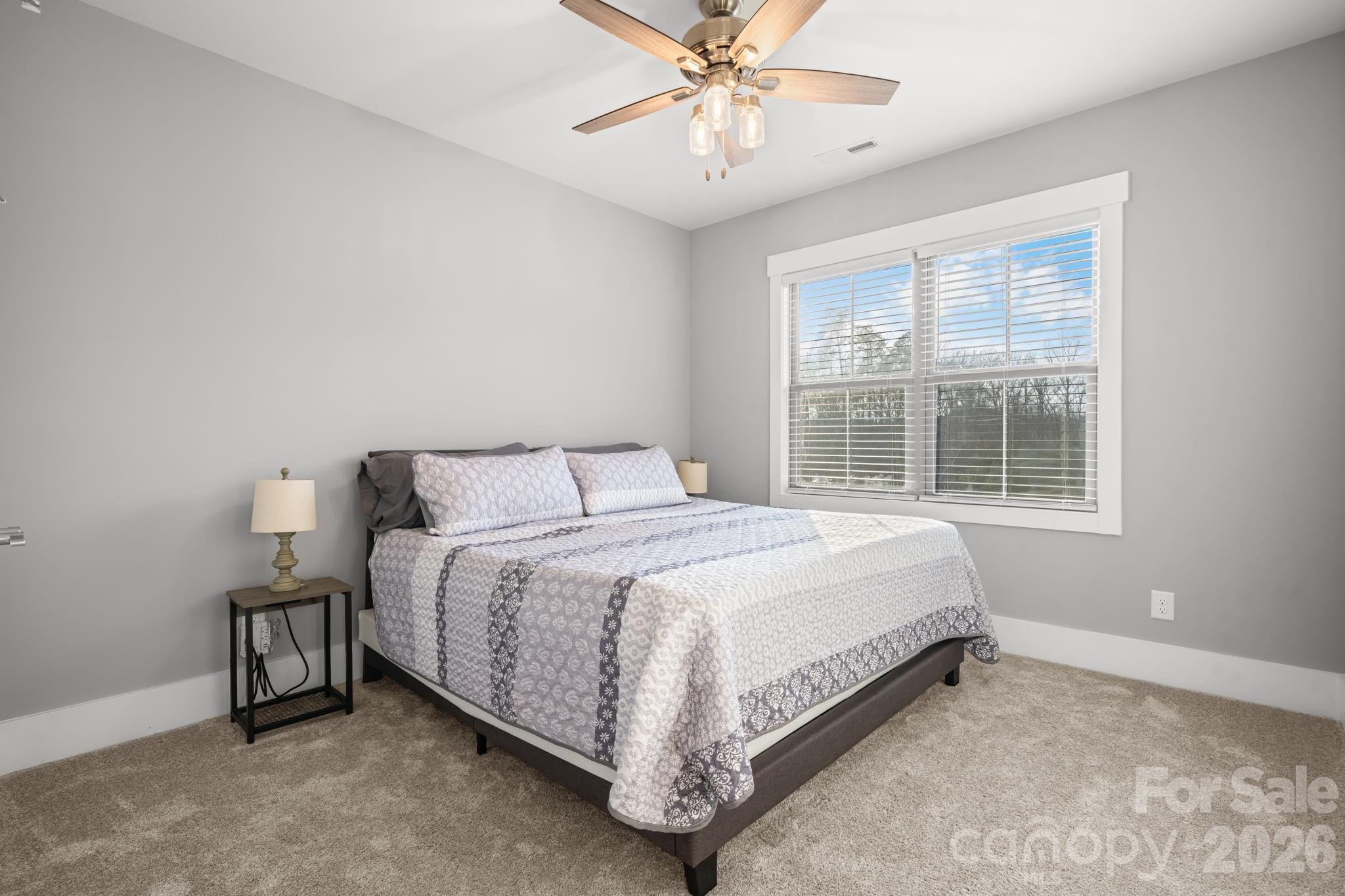 7269 Savannah Denver, NC 28037 - Photo 35 of 48 a large bed sitting in a bedroom next to a window