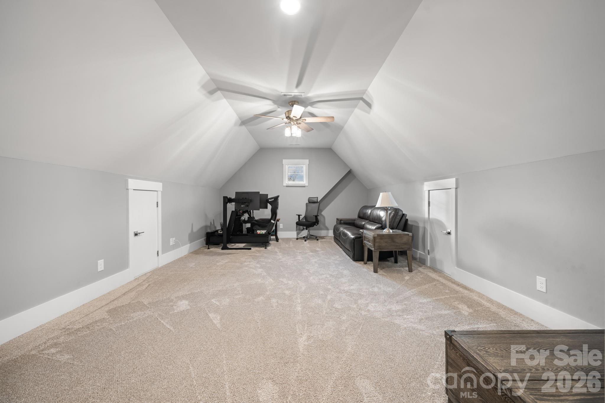 7269 Savannah Denver, NC 28037 - Photo 36 of 48 a living room with furniture and a chandelier