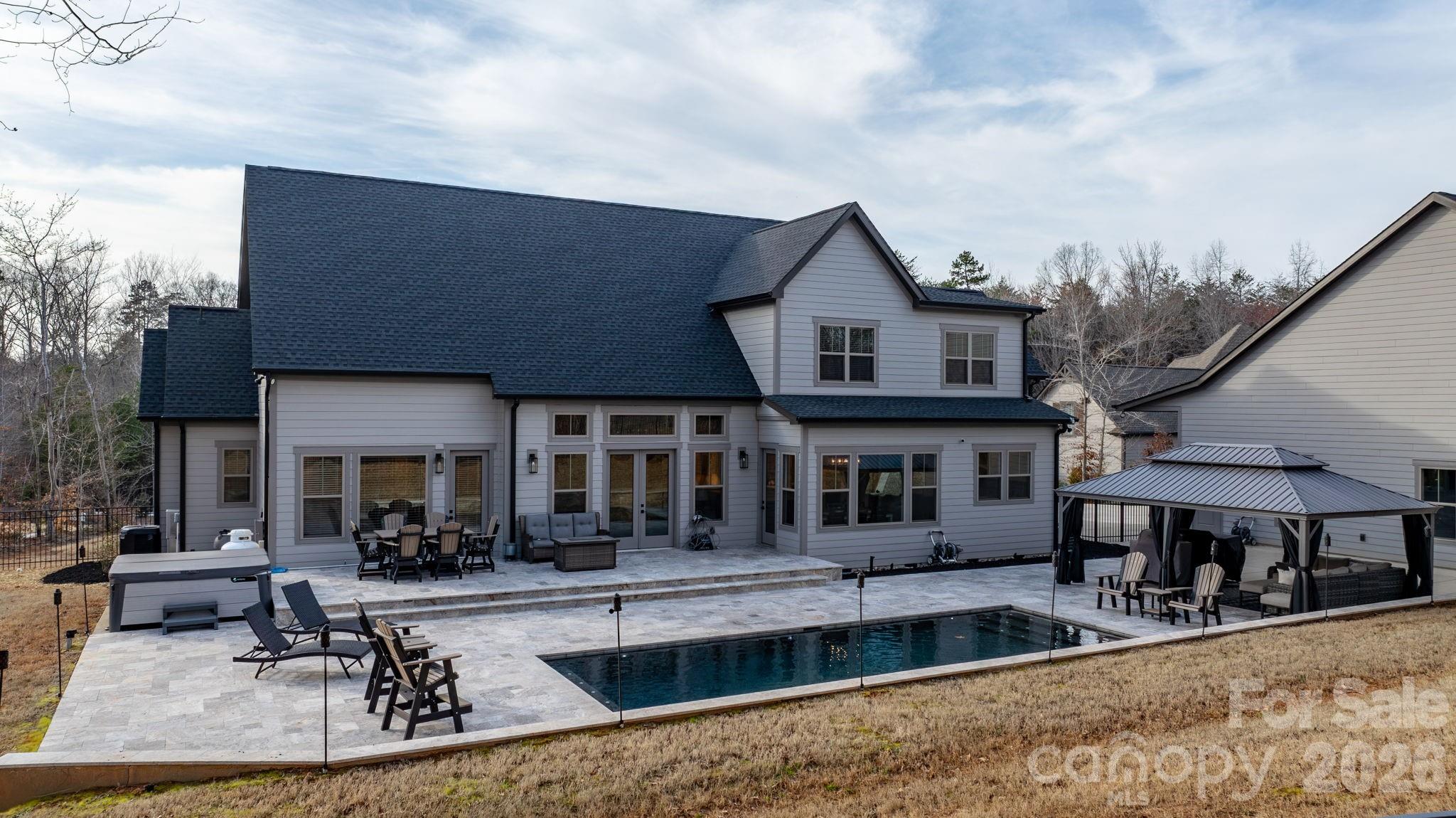 7269 Savannah Denver, NC 28037 - Photo 38 of 48 a view of a house with swimming pool and sitting area