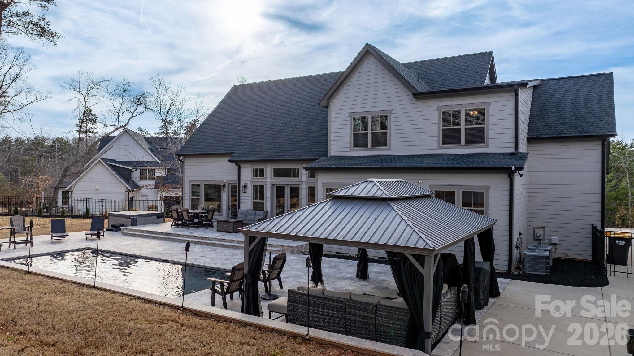 7269 Savannah Denver, NC 28037 - Photo 39 of 48 a front view of a house with porch and furniture