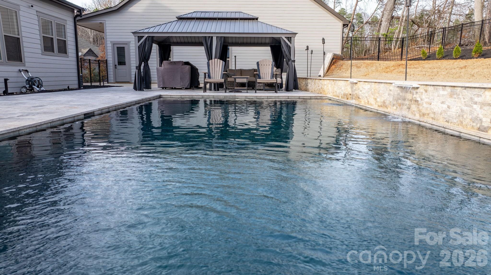 7269 Savannah Denver, NC 28037 - Photo 45 of 48 a view of a swimming pool with outdoor seating