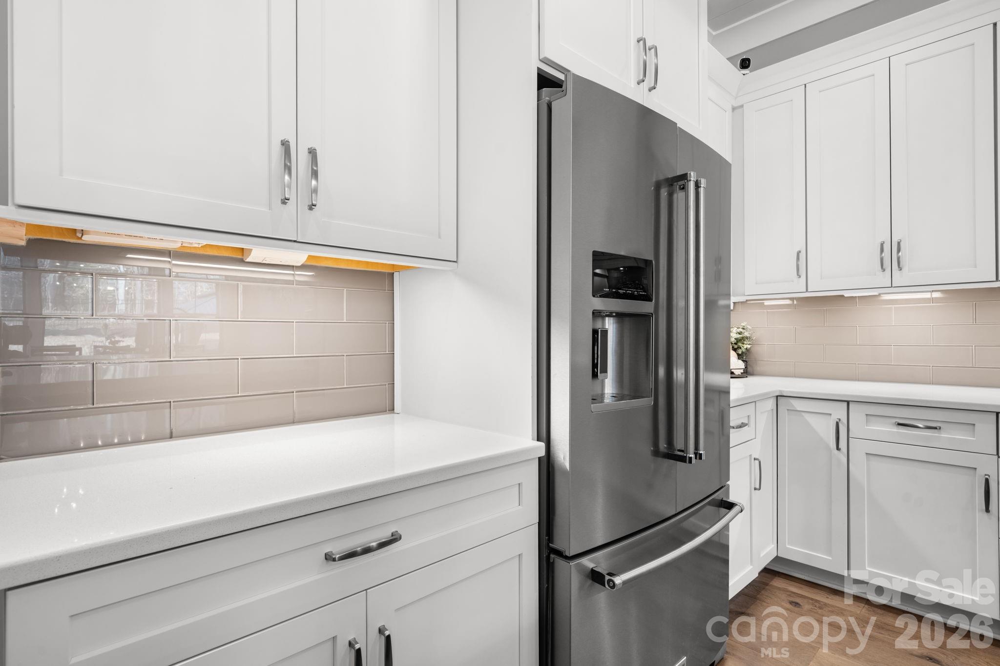 7269 Savannah Denver, NC 28037 - Photo 9 of 48 a kitchen with stainless steel appliances a refrigerator and cabinets