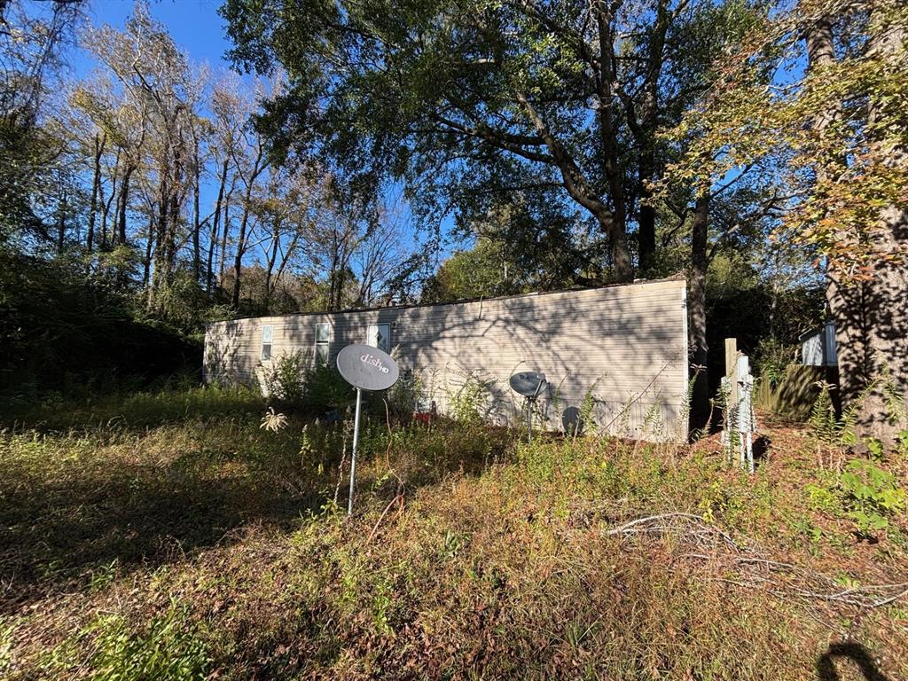1233 Suncrest Circle Jasper, TX 75951 - Photo 3 of 12 a view of water pond with seating space