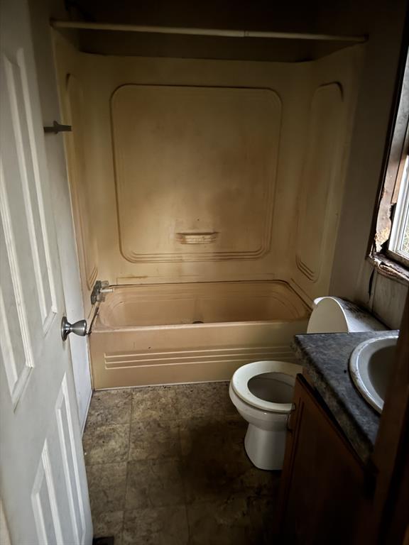 1233 Suncrest Circle Jasper, TX 75951 - Photo 7 of 12 a bathroom with a granite countertop sink toilet and shower