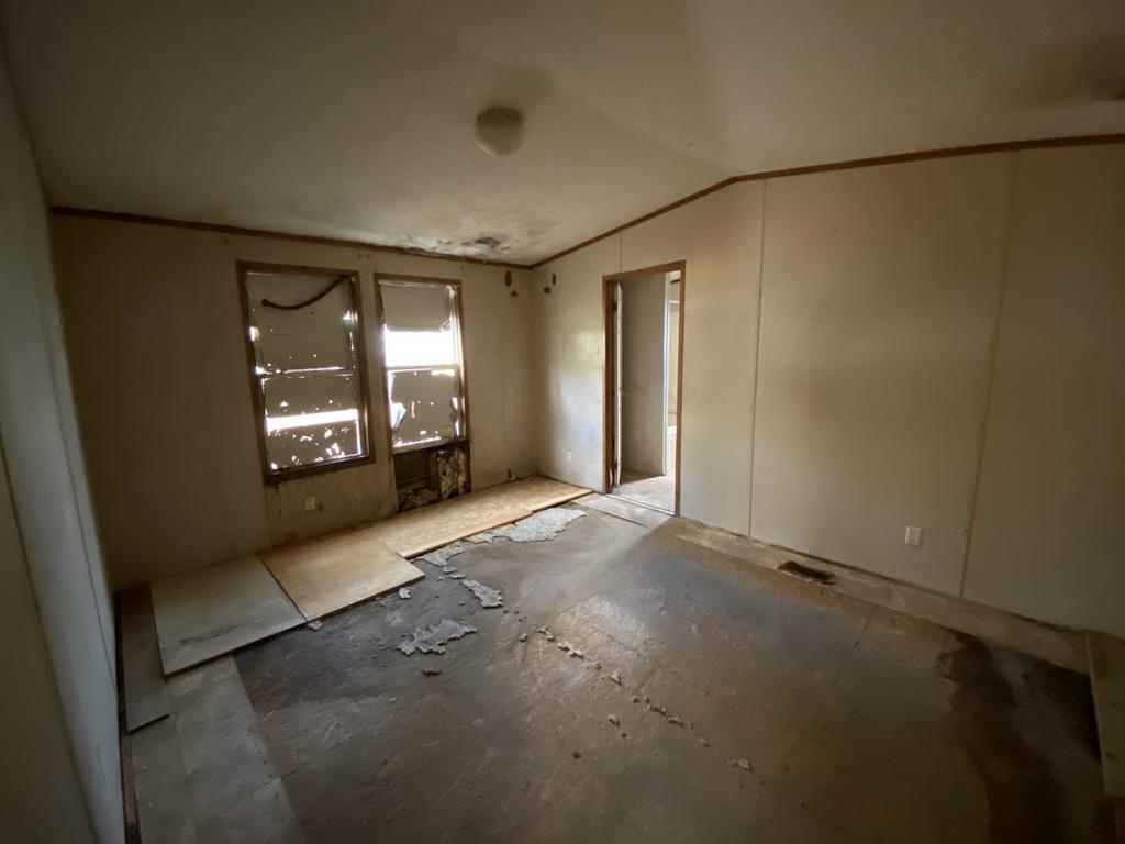 1233 Suncrest Circle Jasper, TX 75951 - Photo 8 of 15 wooden floor in an empty room with a window