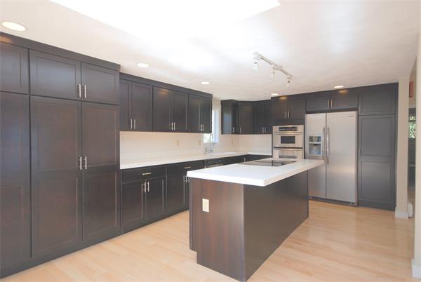 9 Alpine Road Wayland, MA 01778 - Photo 3 of 16 a kitchen with kitchen island stainless steel appliances a sink stove and refrigerator