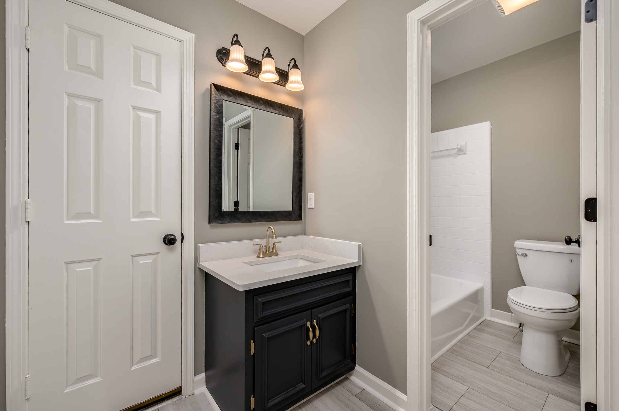 942 General George Patton Road Nashville, TN 37221 - Photo 19 of 23 a bathroom with a sink a toilet and a mirror