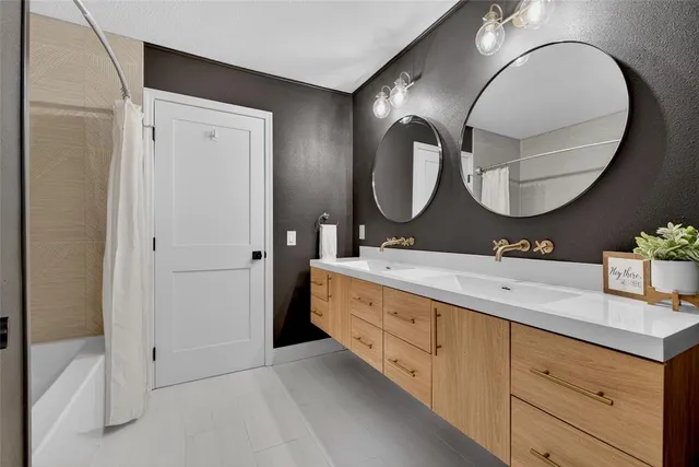 a living room with a couch and a dresser next to a window
