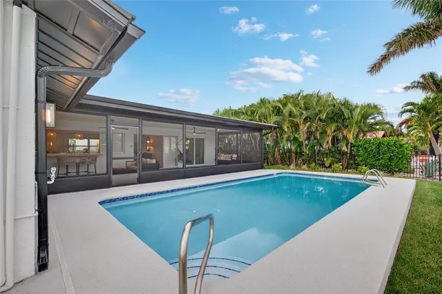 a view of a lake with a table and chairs