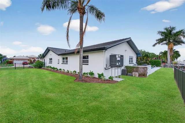 an aerial view of residential building and lake