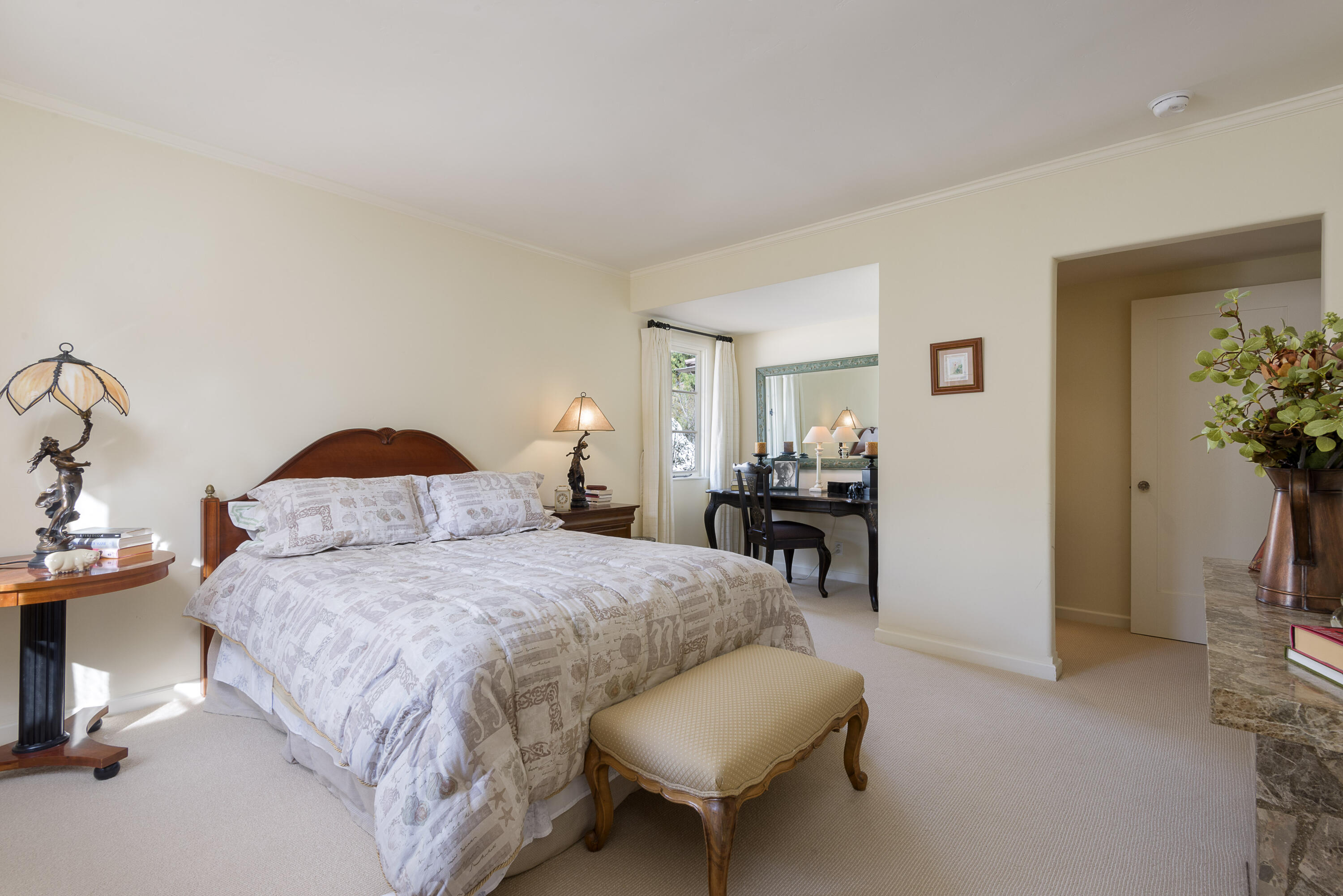 2311 Santa Barbara Street Santa Barbara, CA 93105 - Photo 11 of 20 a bedroom with a bed and a chair