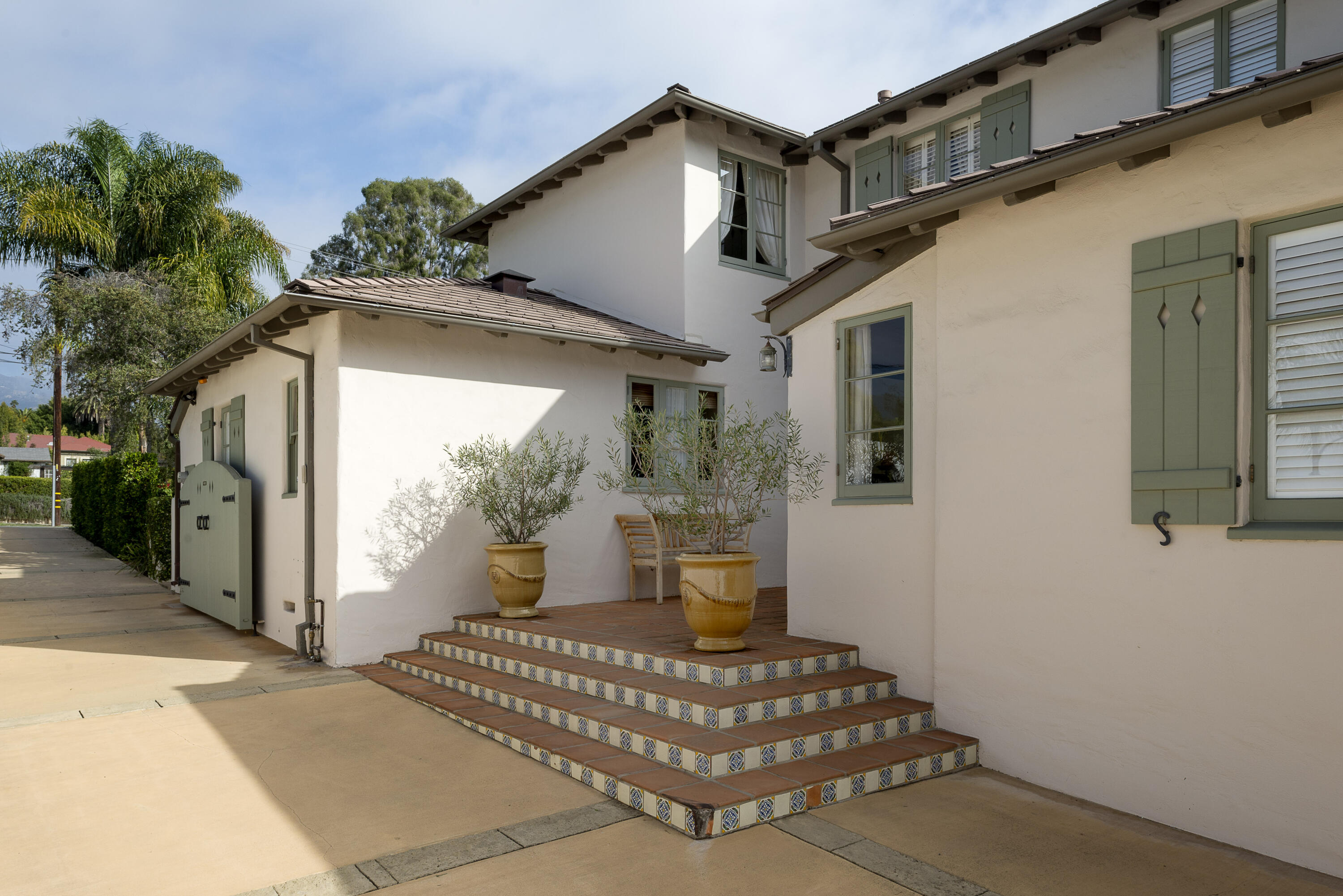 2311 Santa Barbara Street Santa Barbara, CA 93105 - Photo 20 of 20 a white house with tree in front of it