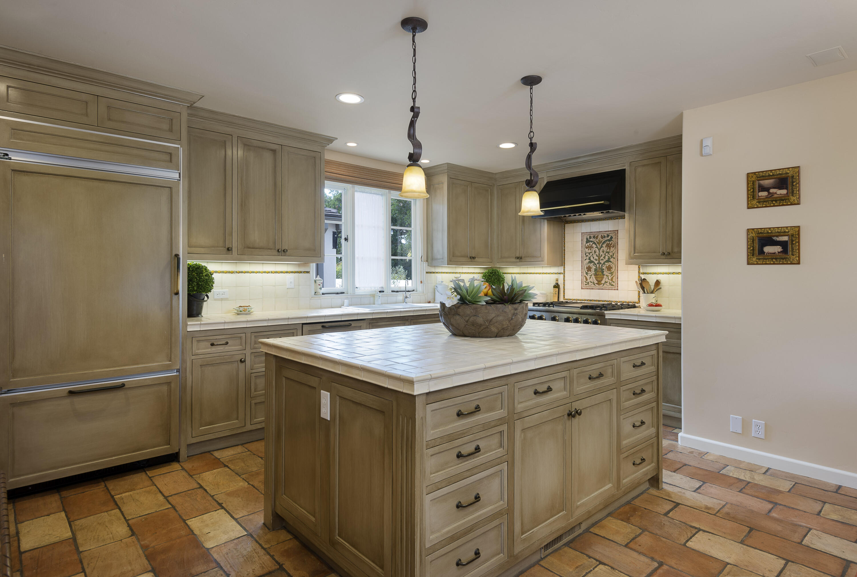 2311 Santa Barbara Street Santa Barbara, CA 93105 - Photo 8 of 20 a kitchen with stainless steel appliances a sink a stove a refrigerator and cabinets