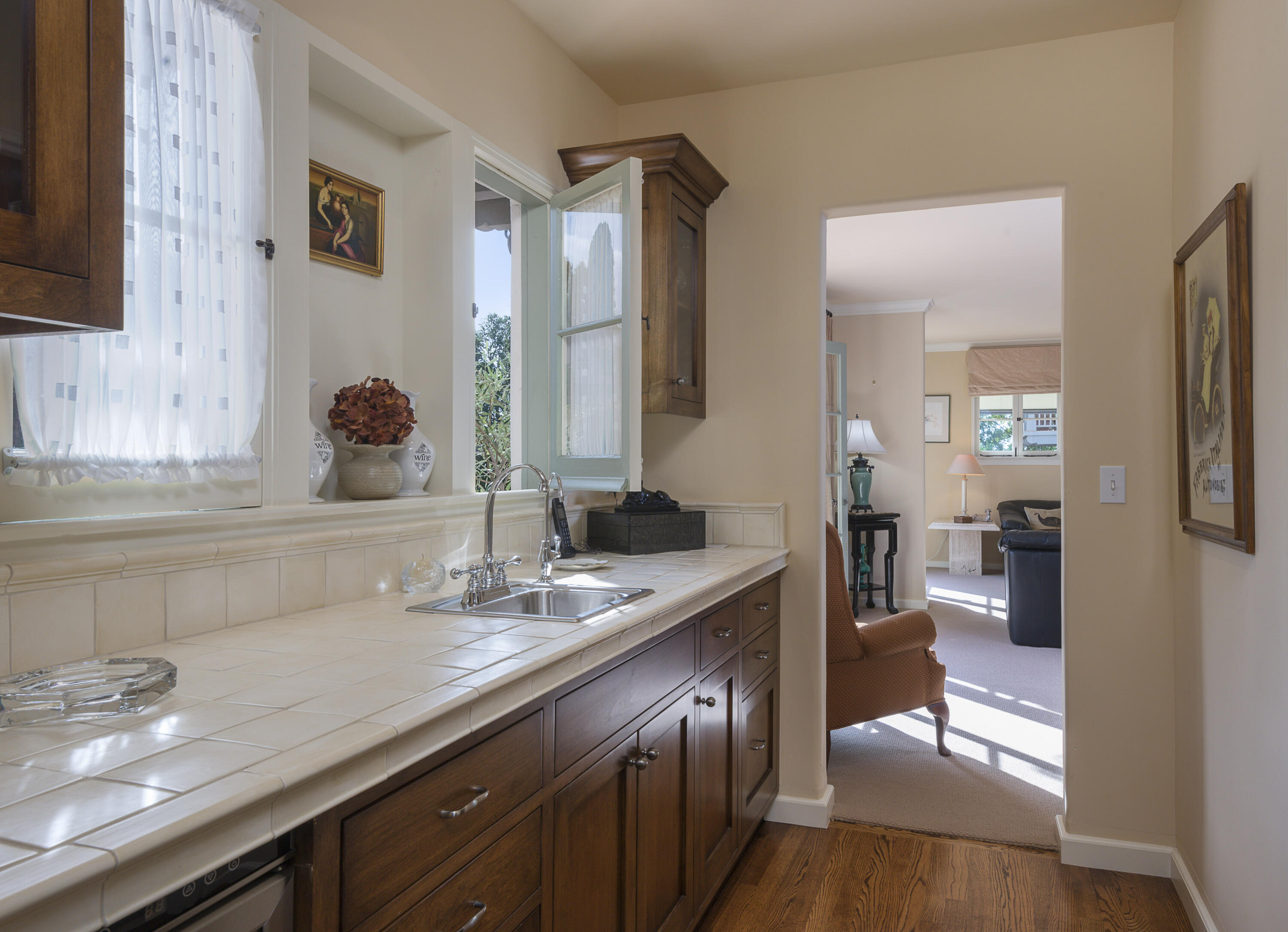 2311 Santa Barbara Street Santa Barbara, CA 93105 - Photo 9 of 20 a bathroom with a granite countertop sink a mirror and a