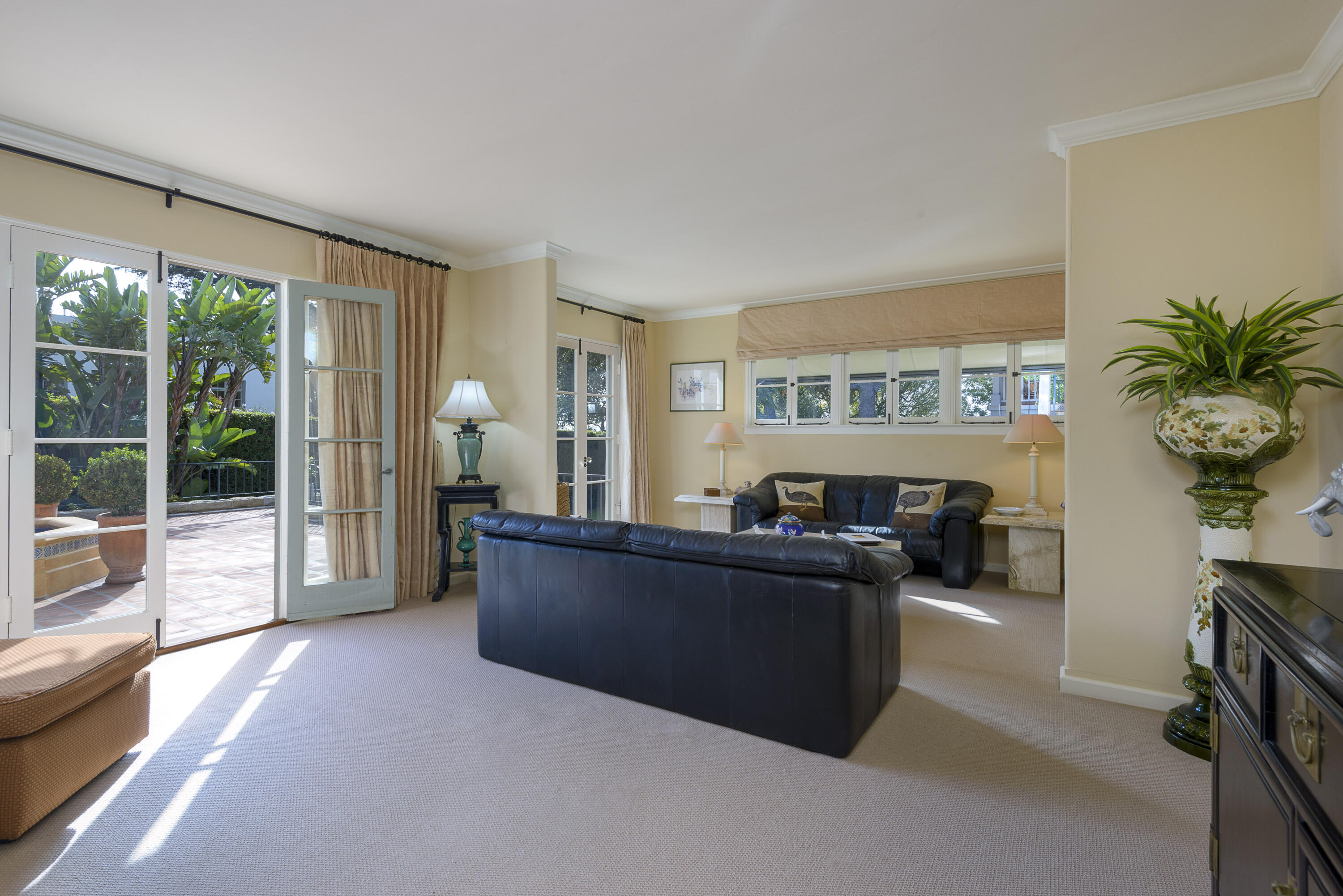 2311 Santa Barbara Street Santa Barbara, CA 93105 - Photo 10 of 20 a living room with furniture and large windows