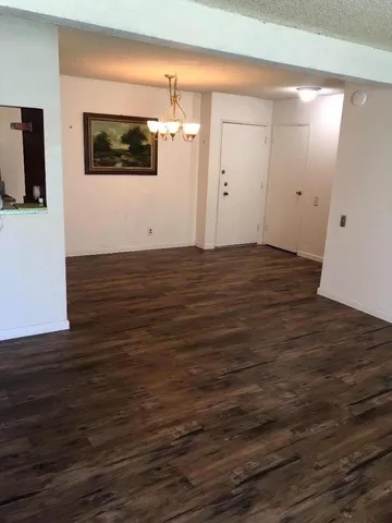 a view of a livingroom with wooden floor