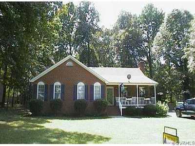 10606 Surry Road Chester, VA 23831 - Photo 1 of 1 a front view of a house with a yard