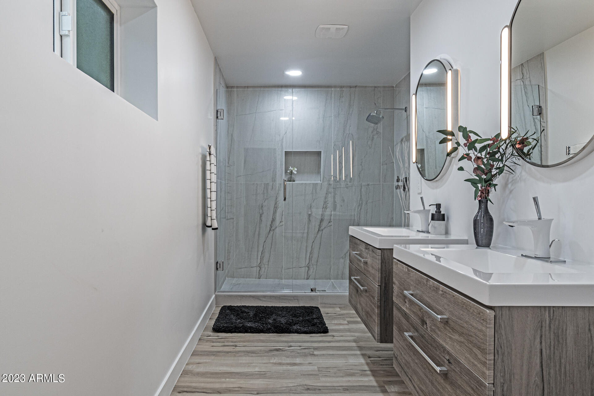 1539 West Puget Avenue Phoenix, AZ 85021 - Photo 17 of 27 a bathroom with a sink and a mirror