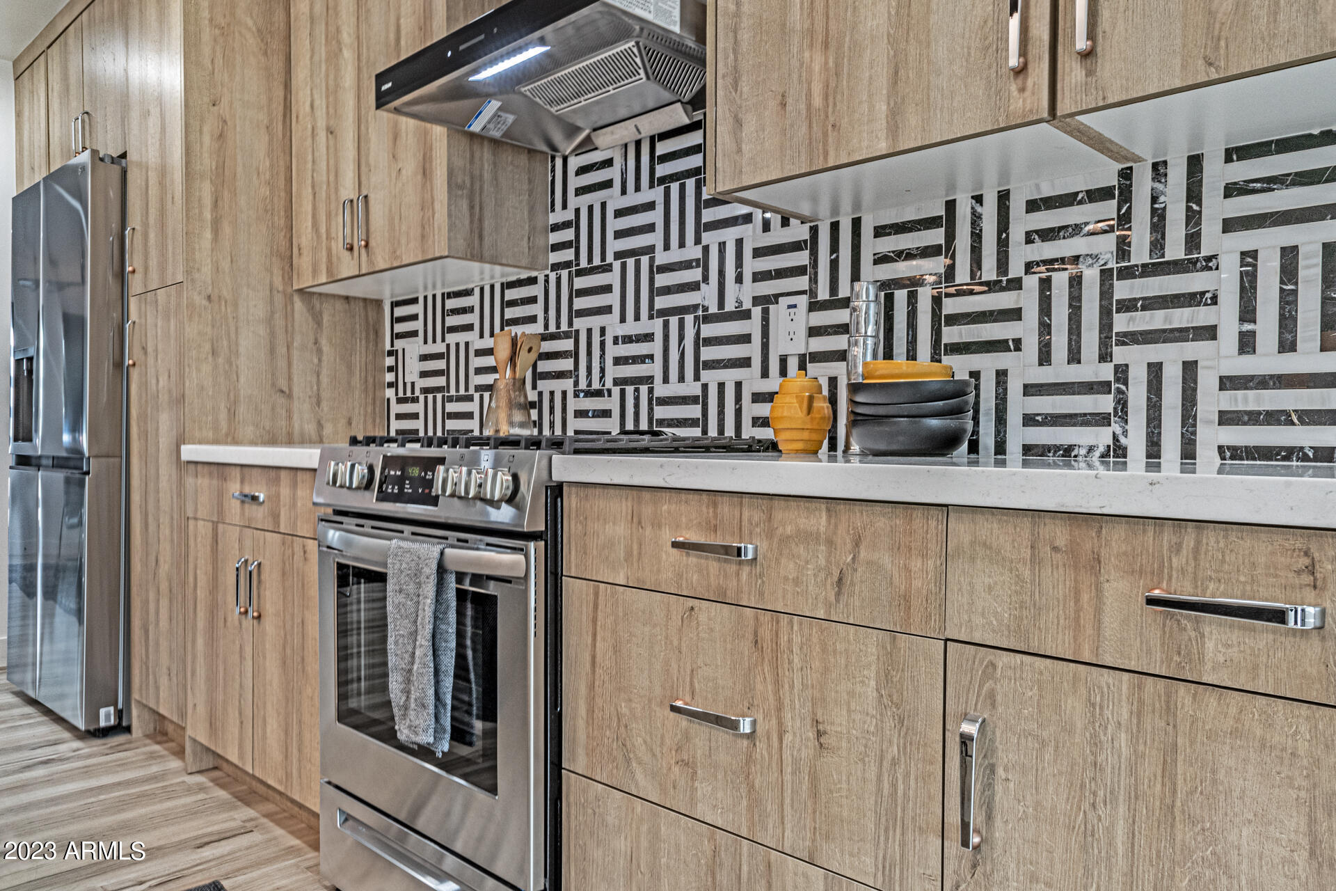 1539 West Puget Avenue Phoenix, AZ 85021 - Photo 4 of 27 a kitchen with stainless steel appliances and cabinets