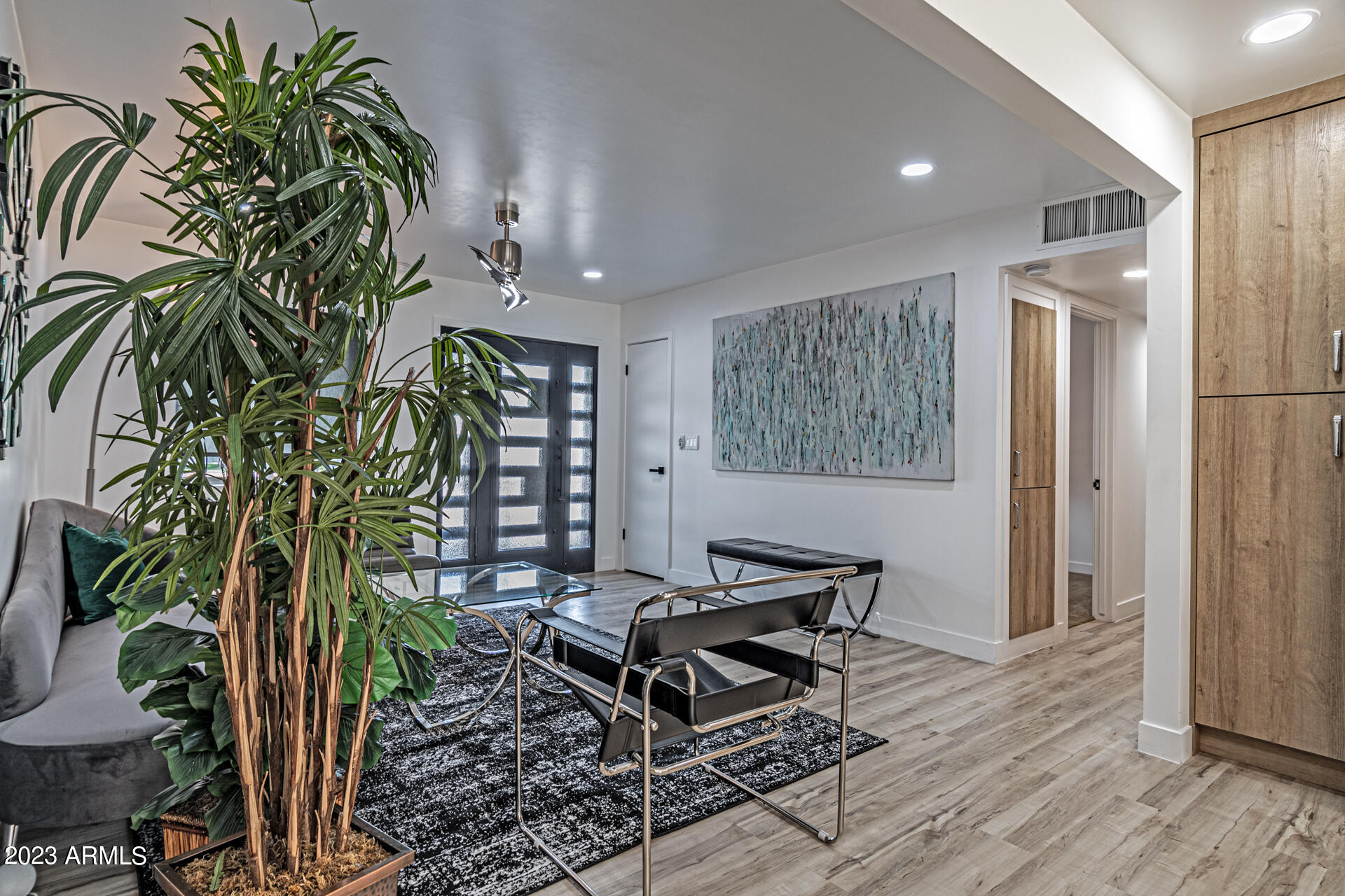 1539 West Puget Avenue Phoenix, AZ 85021 - Photo 6 of 27 a living room with furniture and a potted plant