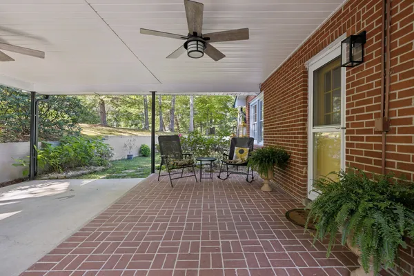a view of a house with a yard and garage
