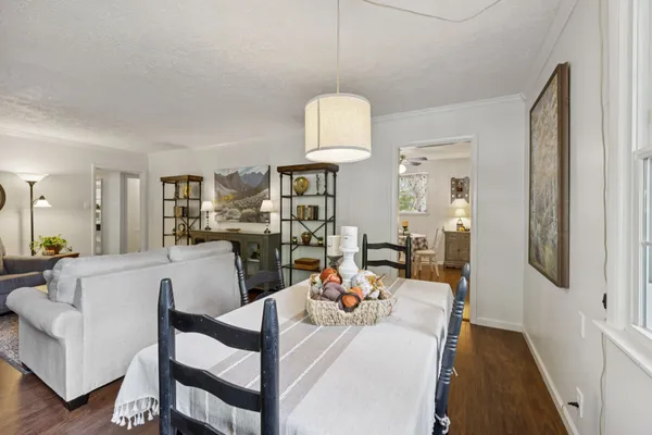 a living room with furniture and a rug