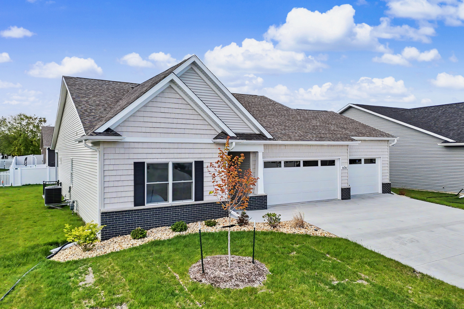 606 Kevin Road Blue Grass, IA 52726 - Photo 1 of 33 a view of a house with a yard and sitting area