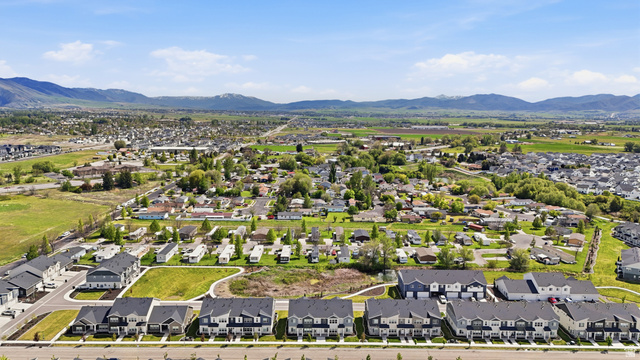 1173 West 1870 South Logan, UT 84321 - Photo 29 of 33 Expansive aerial overview showcasing a residential community with a mountain backdrop