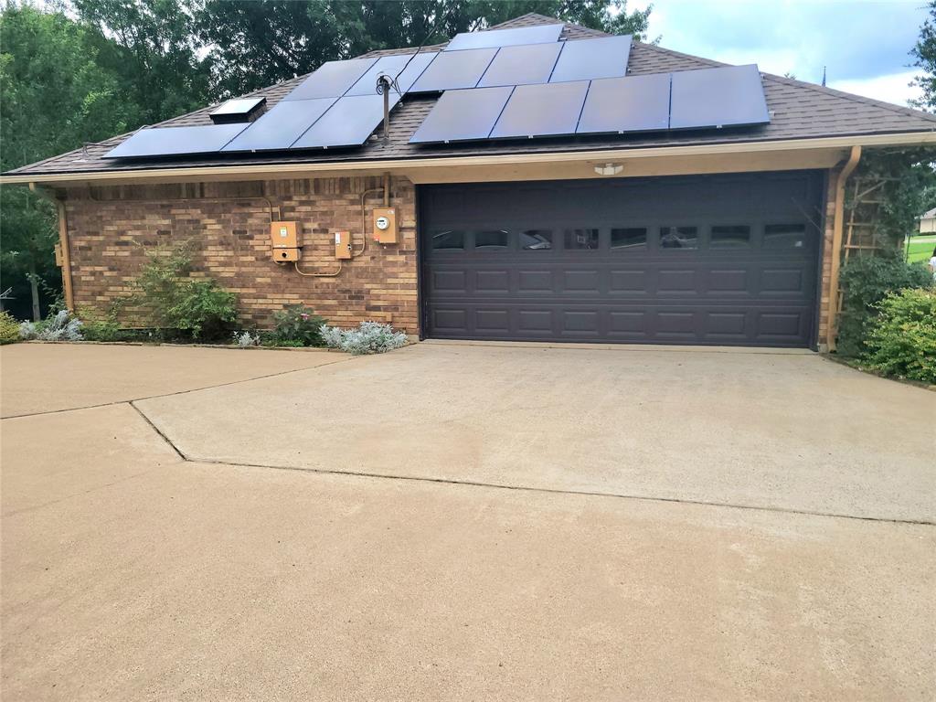 912 North Dove Road Grapevine, TX 76051 - Photo 34 of 36 a front view of a house with a yard and garage