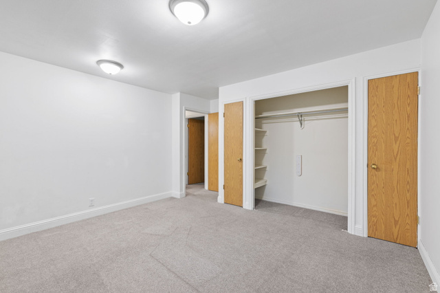 875 Cedar Hollow Road Lehi, UT 84043 - Photo 59 of 76 Plush carpeting, recessed closet with shelving, two panel doors, and two flush-mount ceiling lights