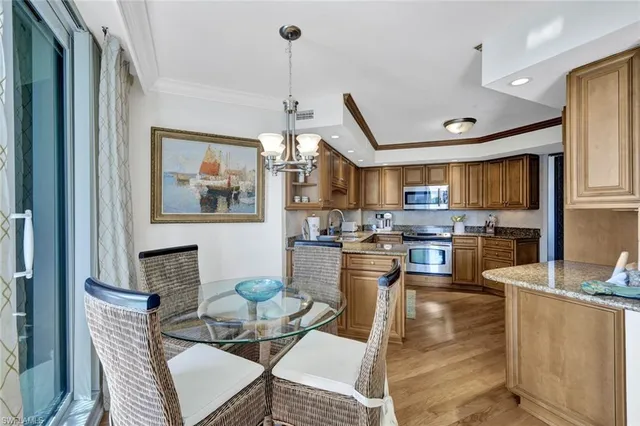 a living room with lots of furniture and kitchen view