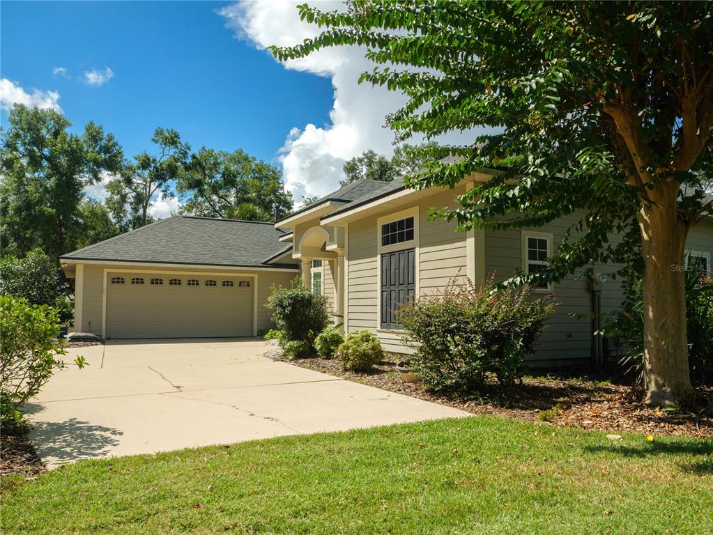 1488 Southwest 84th Terrace Gainesville, FL 32607 - Photo 2 of 31 a front view of house with yard and trees