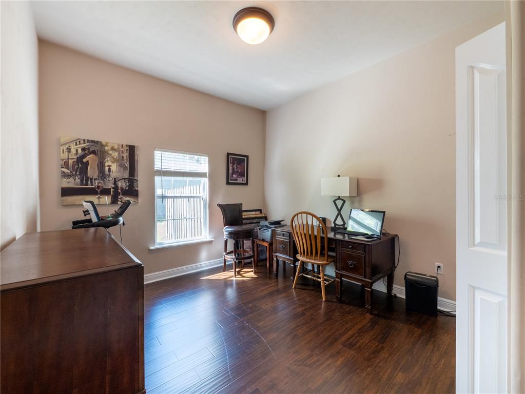 1488 Southwest 84th Terrace Gainesville, FL 32607 - Photo 23 of 31 a view of a workspace with furniture and a window