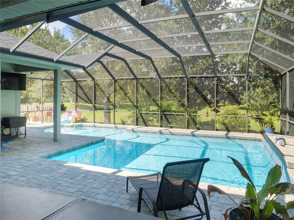 1488 Southwest 84th Terrace Gainesville, FL 32607 - Photo 26 of 31 a swimming pool with outdoor seating