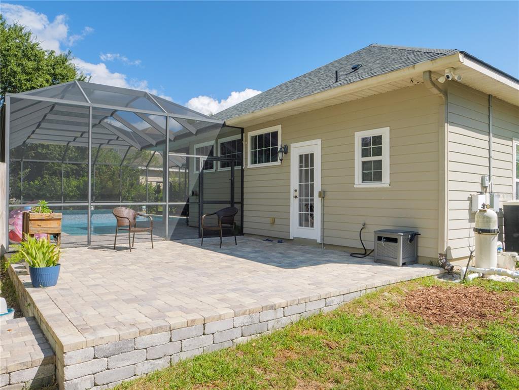 1488 Southwest 84th Terrace Gainesville, FL 32607 - Photo 29 of 31 a backyard of a house with table and chairs