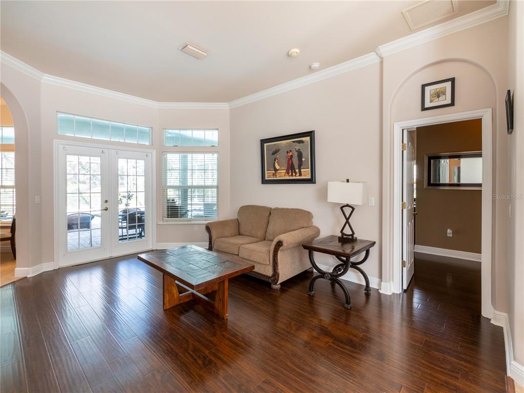1488 Southwest 84th Terrace Gainesville, FL 32607 - Photo 4 of 31 a living room with furniture and wooden floor